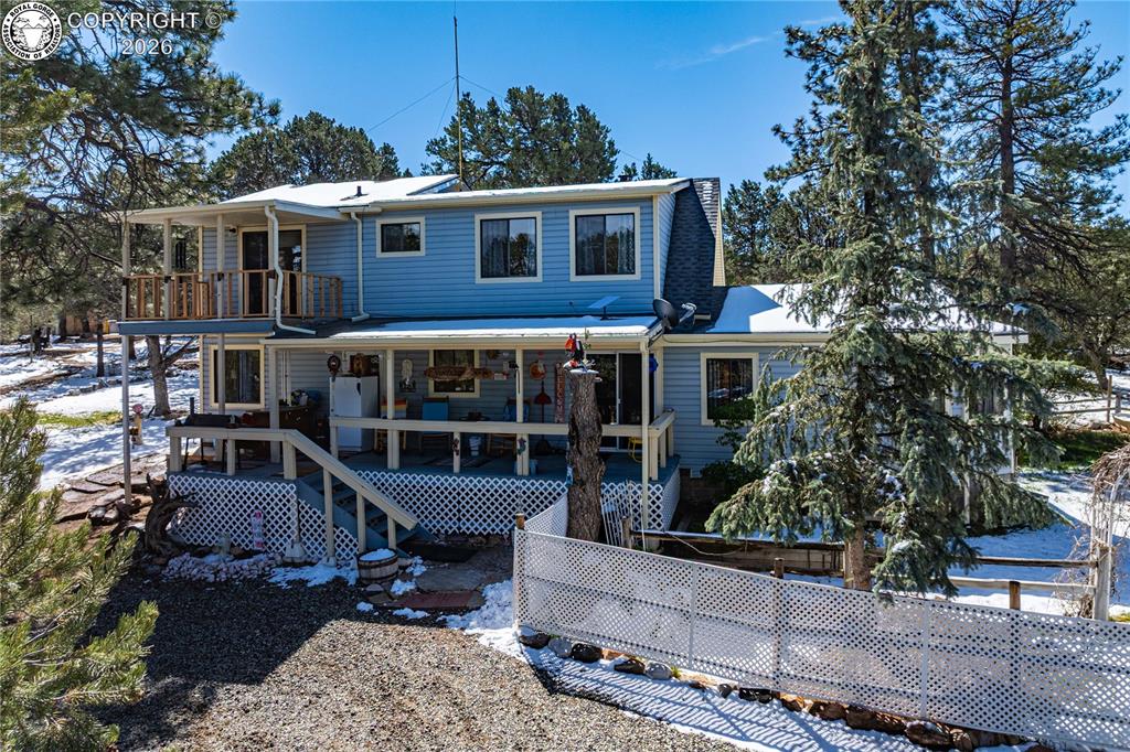Caption: New Roof, covered deck and private deck off master BR