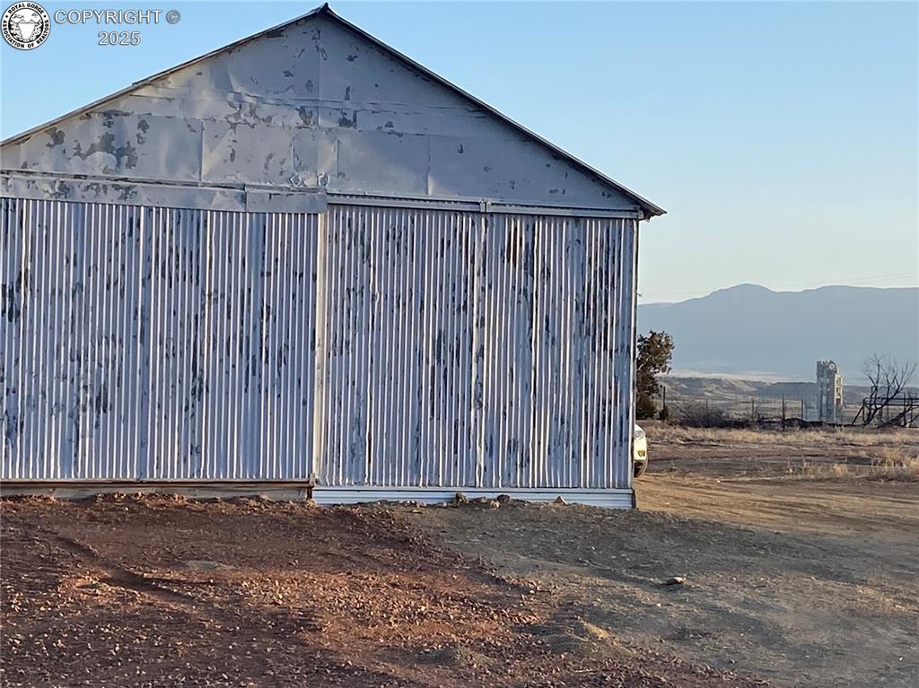 Caption: View of outbuilding with a mountain view and an outdoor structure