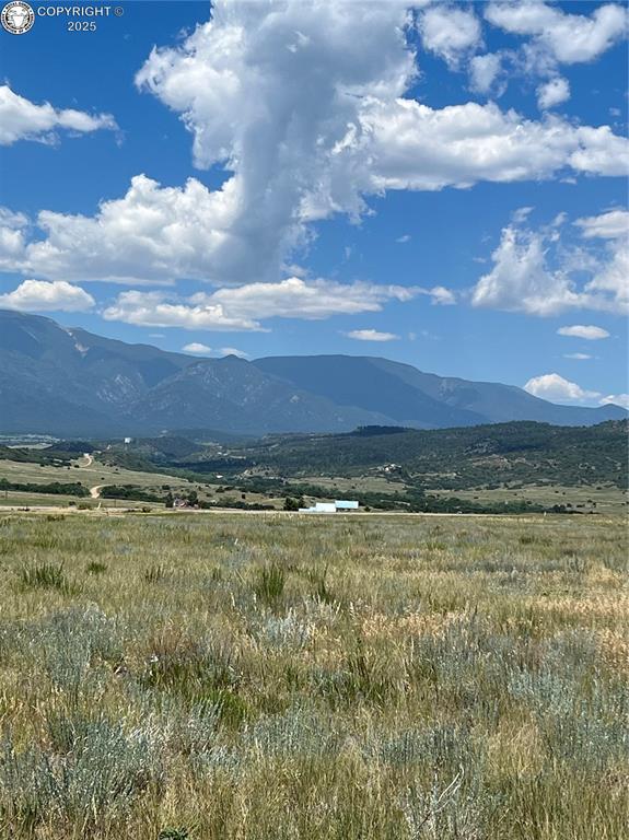 Caption: View of mountain backdrop featuring rural landscape