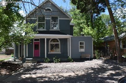 Caption: View of front of house with a porch