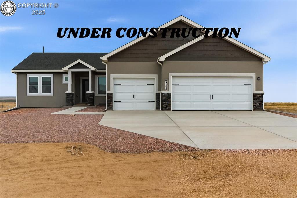 Caption: Craftsman-style house with concrete driveway, stone siding, an attached garage, and stucco siding