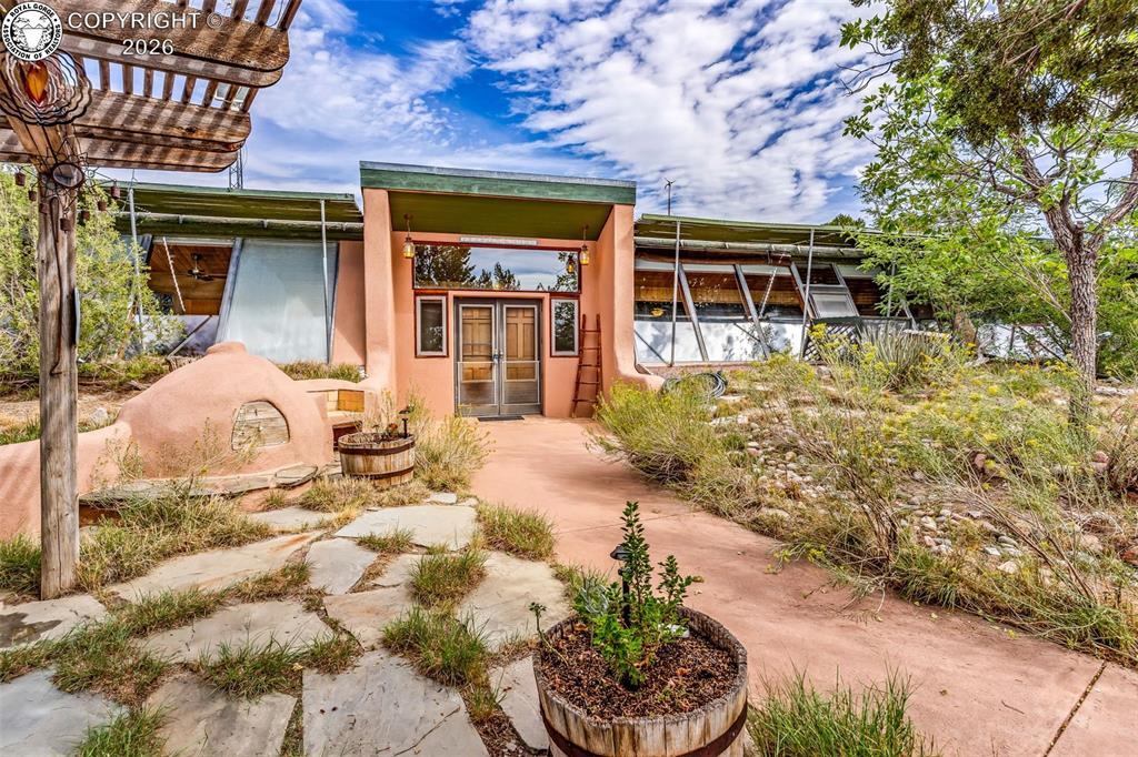 Caption: Welcome to “La Milpa,” a truly distinctive Earthship home situated on 40.23 acres in the wide-open l