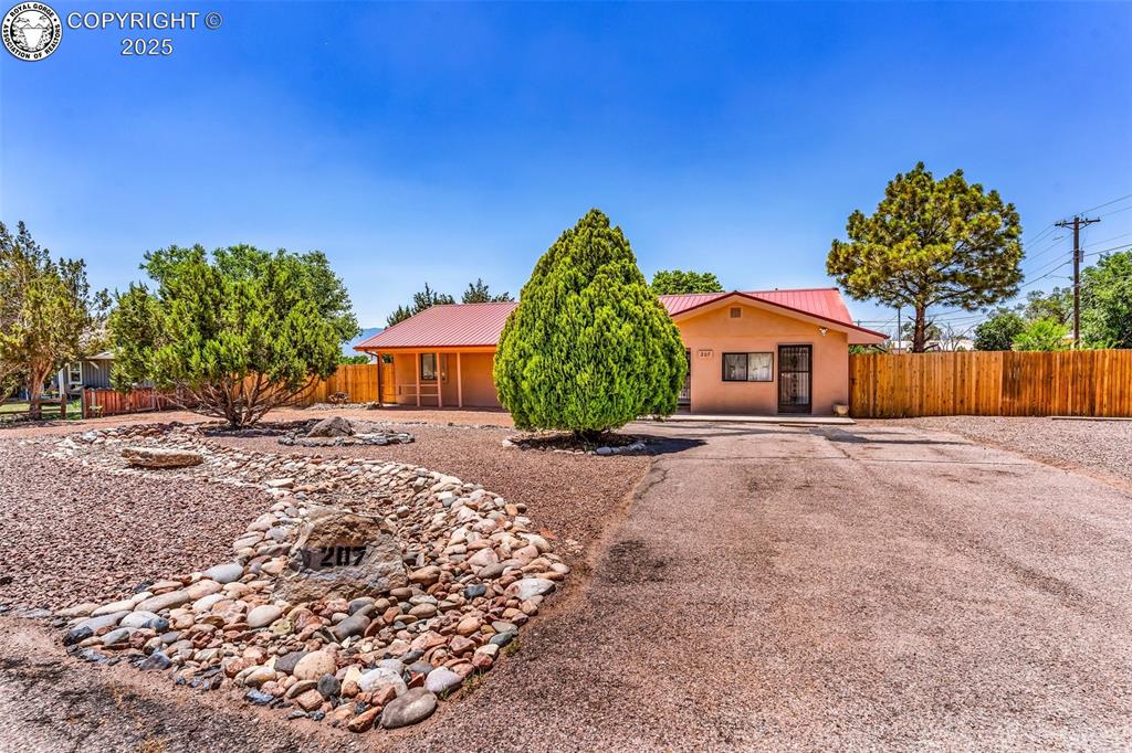 Caption: View of front of property with a metal roof