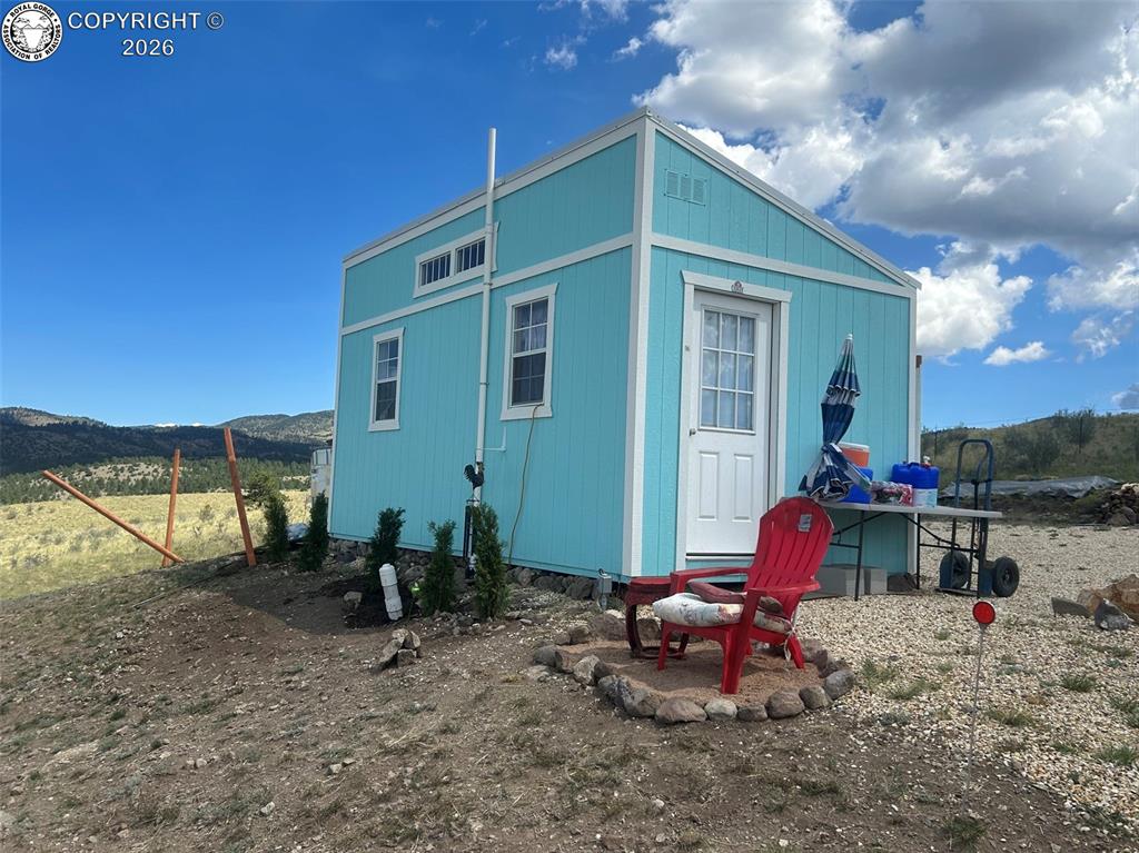 Caption: Light blue siding with white trim