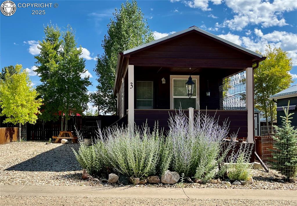 Caption: View of front of house featuring covered porch