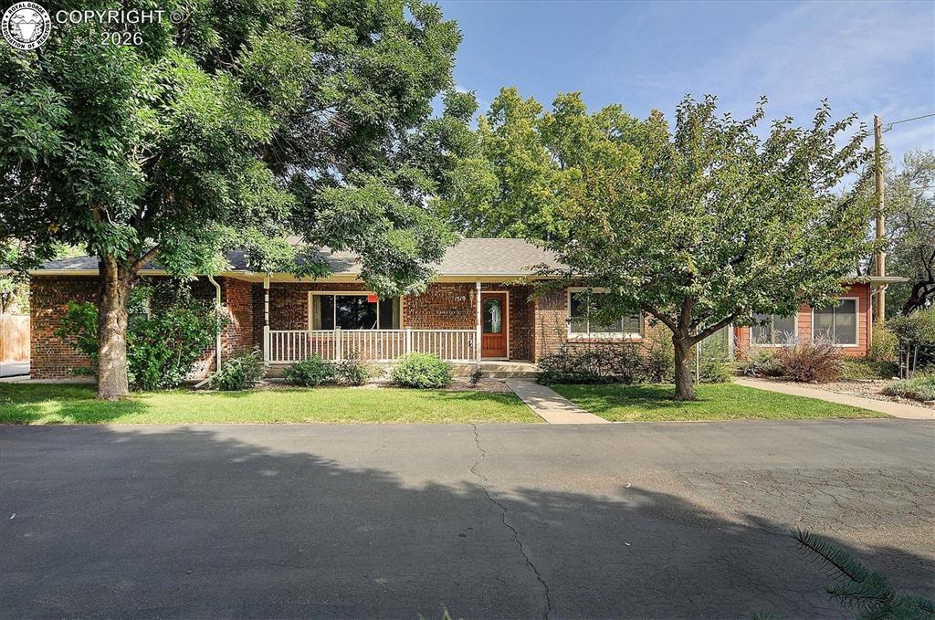 Caption: Beautiful brick rancher on .82 acres on the Bluff