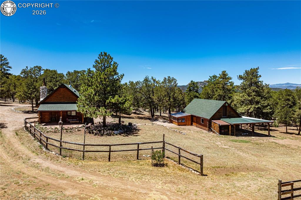Caption: Cabin and Large Shop in Fenced 5 Acres