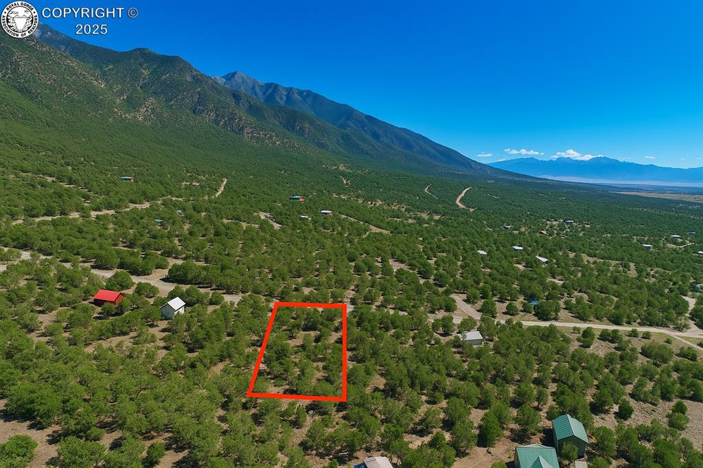 Caption: View of property location with mountains and property boundaries highlighted