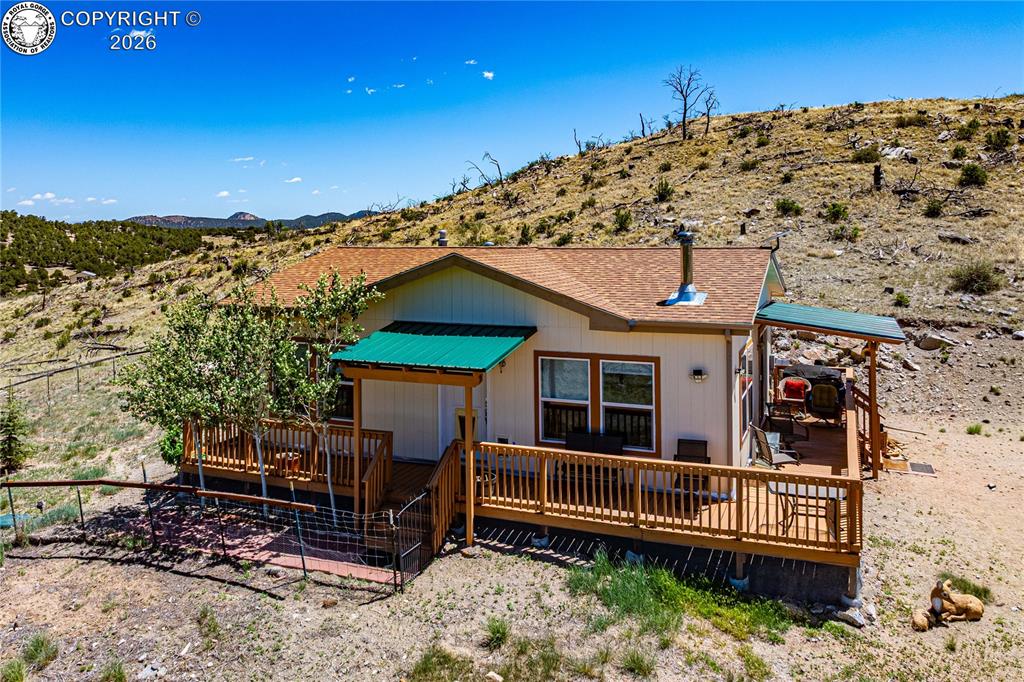 Caption: Wrap Around Deck to enjoy the HUGE VIEW
