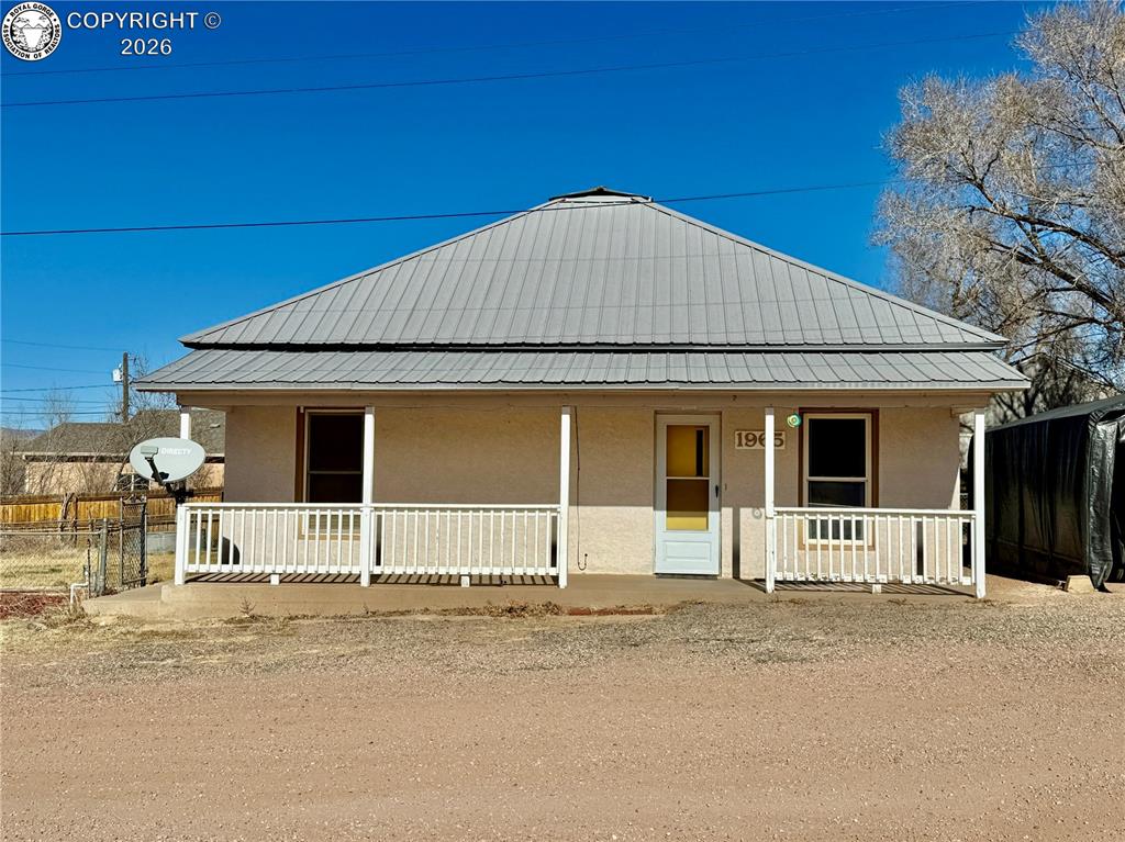 Caption: Enjoy the views from the cute, covered front porch.