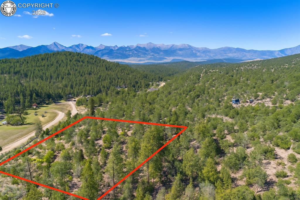 Caption: View of property location featuring a mountain backdrop and property parcel outlined