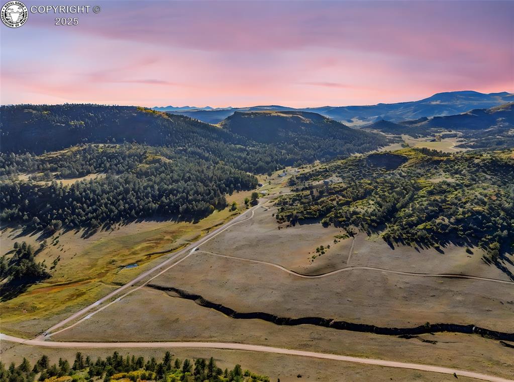 Caption: Aerial view at dusk of a mountain view