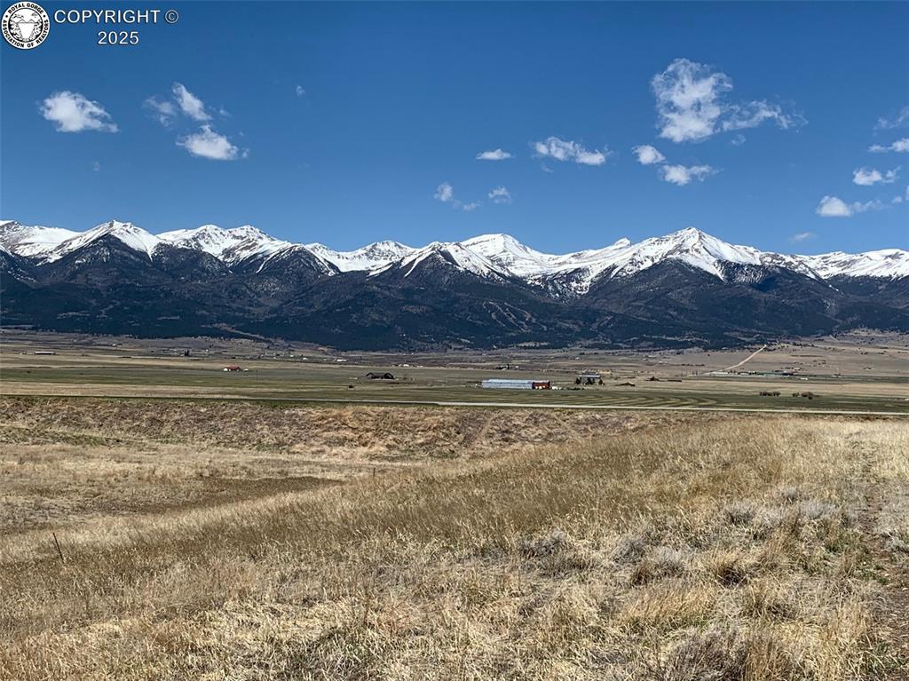Caption: View of mountain feature with a rural view