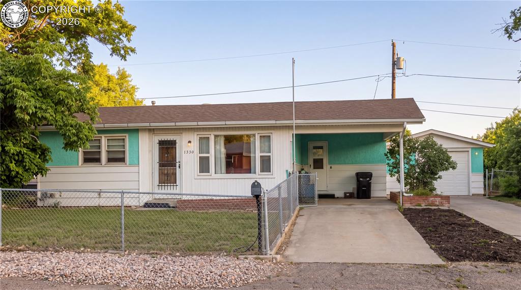 Caption: Arrive at a charming, private sanctuary wrapped in a secure perimeter fence that immediately instill