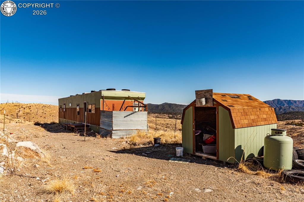 Caption: Mobile home and shed