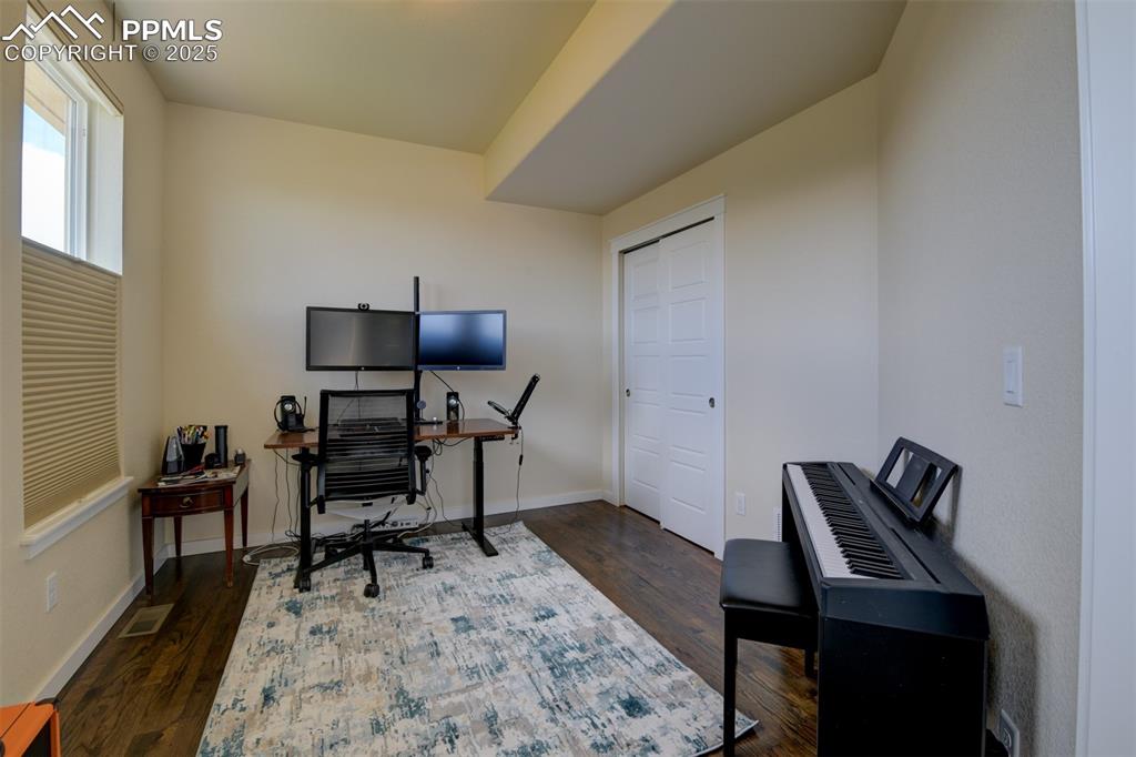 Image 21 of 45: Currently used as an office, this main level bedroom is great