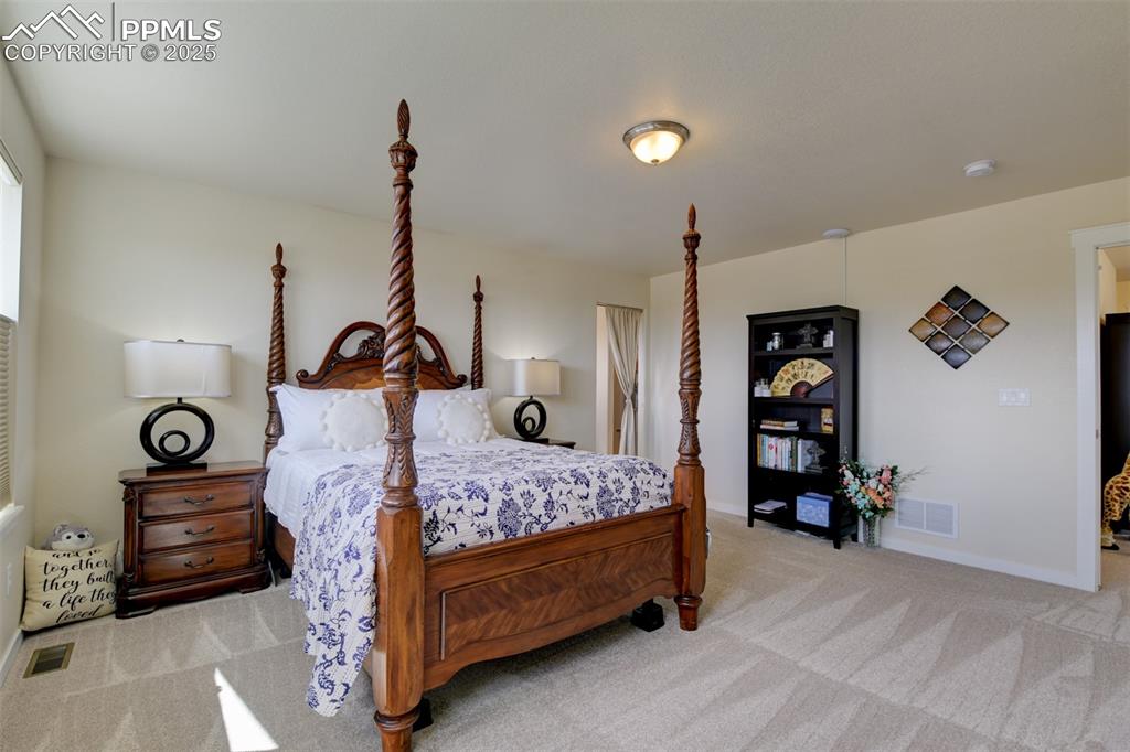 Image 26 of 45: Primary bedroom adjoins a 5 piece bath and huge walk in closet