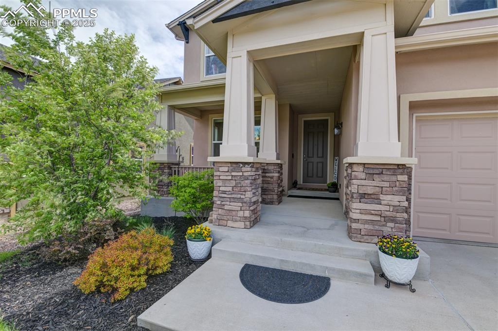 Image 3 of 45: Hard working stucco and stone exterior...