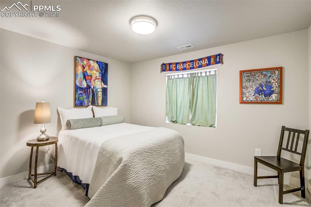 Image 40 of 44: Private 5th bedroom in the basement for guest next to its own full bath. 