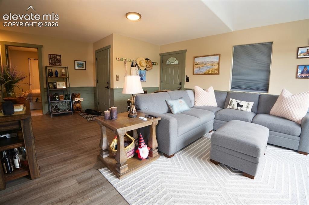 Image 12 of 46: Wood-finish flooring throughout, with neutral wall paint and a contrasting
