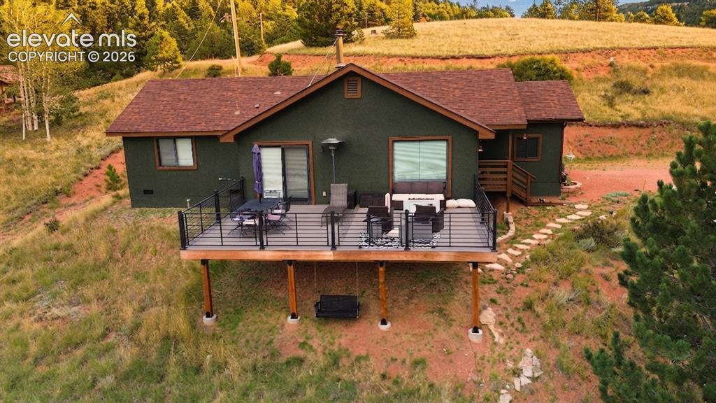 Image 30 of 46: Elevated deck with black railing system and wood-finish support beams