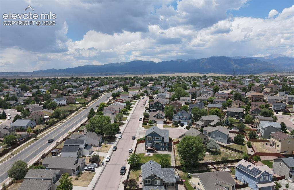 Image 13 of 13: Residential area featuring multiple single-family homes with pitched roofs,