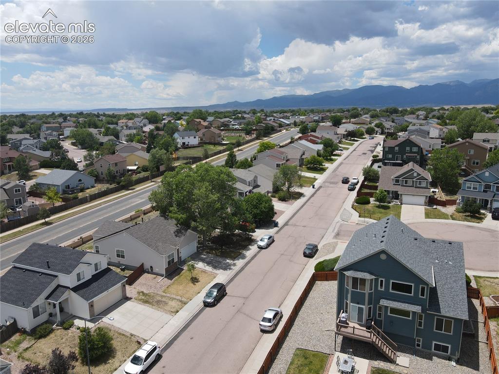 Image 14 of 17: Suburban neighborhood featuring a mix of residential properties with varied