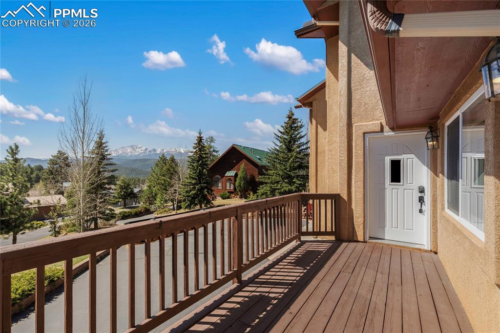 Image 1 of 29: Expansive outdoor deck with wood-finish flooring and railing