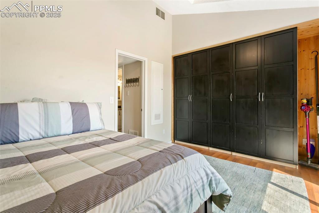 Image 14 of 17: Primary bedroom with vaulted ceiling and skylight
