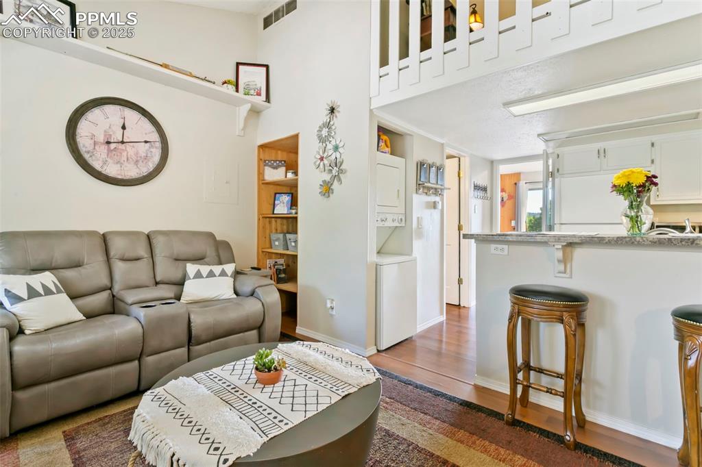 Image 4 of 17: Living room and breakfast bar