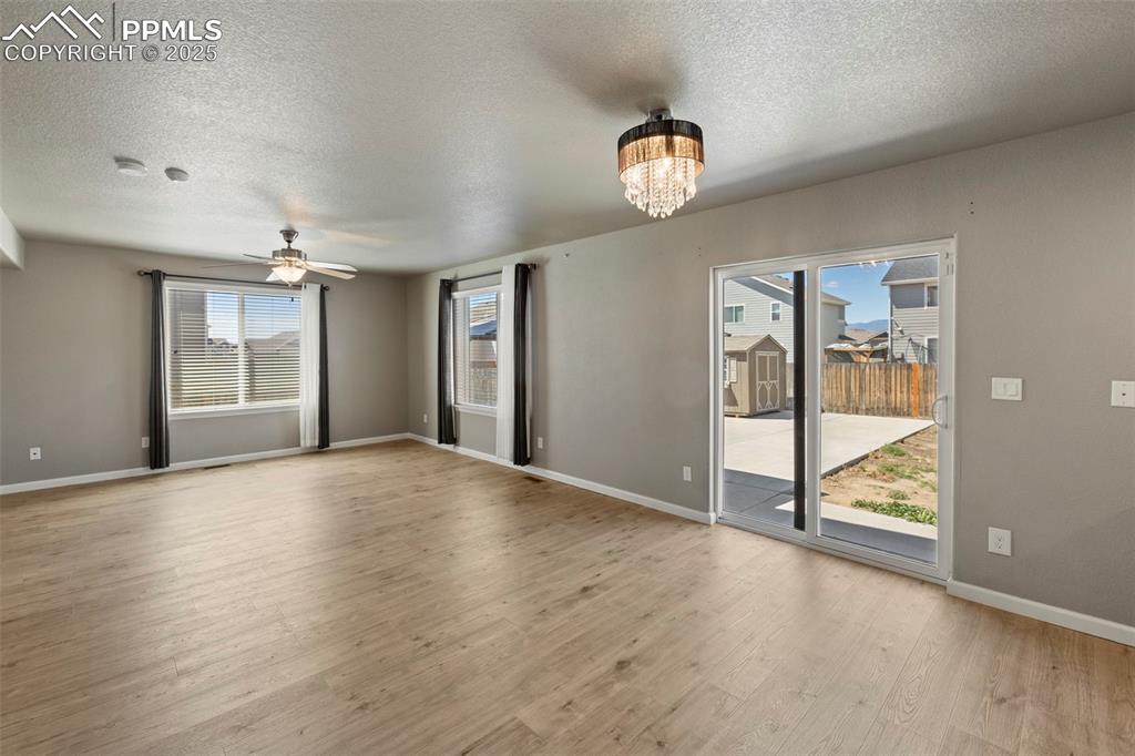 Image 14 of 35: Continue through the main level to find a bright and open living room, a sp