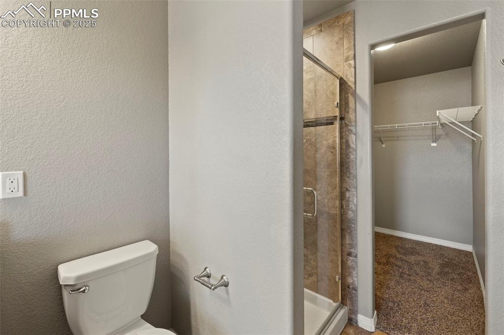 Image 22 of 35: The primary suite offers a luxurious 5-piece bathroom with granite counters