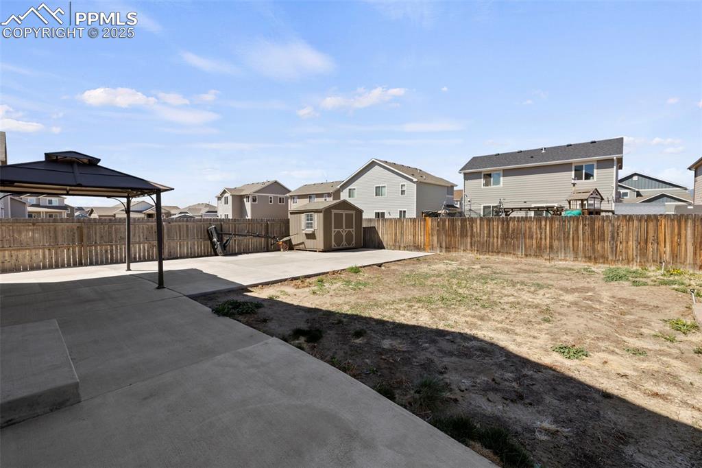 Image 30 of 35: Step outside to enjoy the large concrete wrap-around patio that extends aro