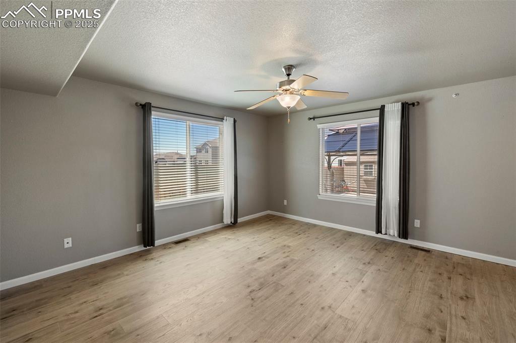 Image 8 of 35: Continue through the main level to find a bright and open living room, a sp