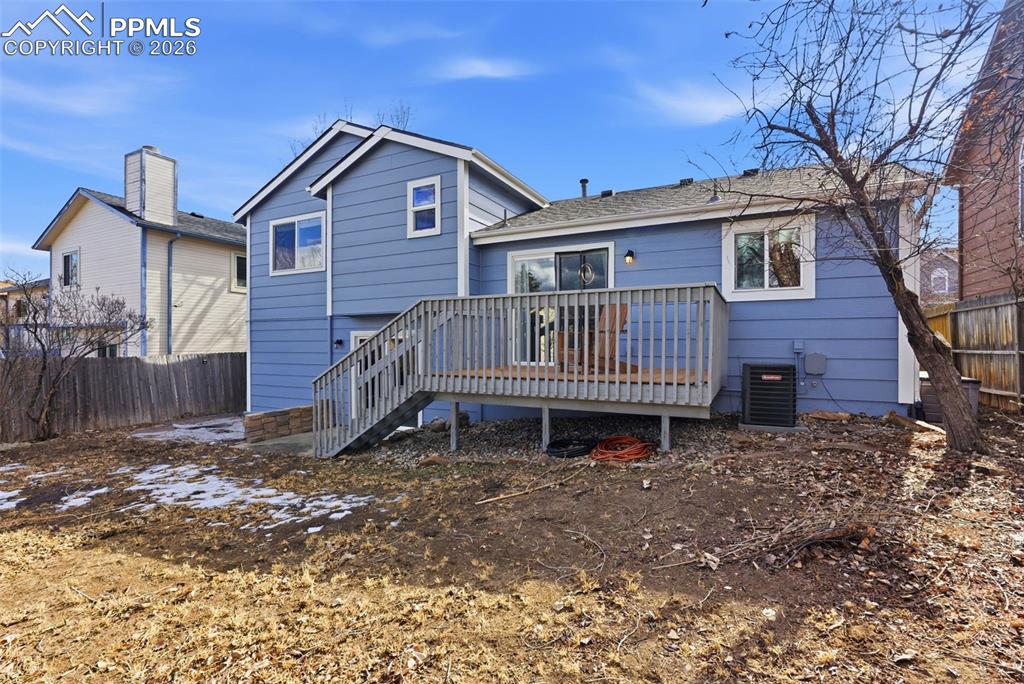 Image 36 of 45: Back of house with a deck