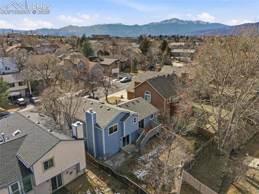 Image 38 of 45: Aerial view of residential area with mountains