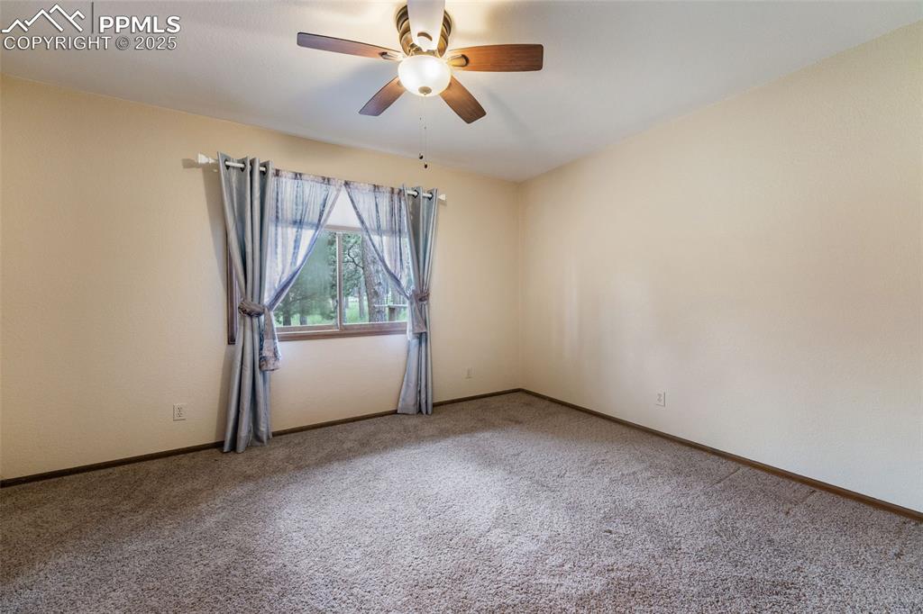 Image 11 of 43: Main level bedroom #1
with carpet