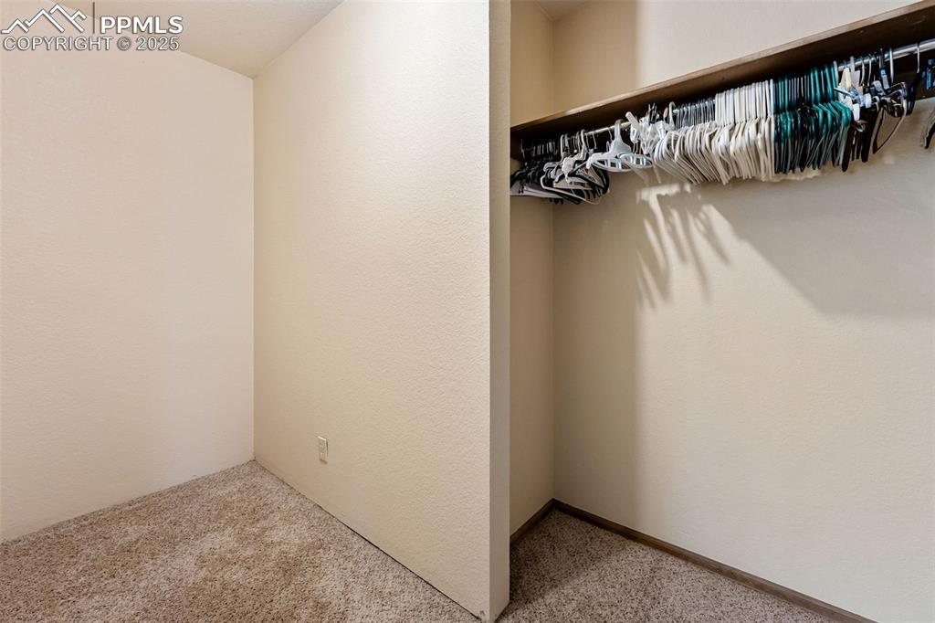 Image 17 of 43: Primary bedroom walk-in closet