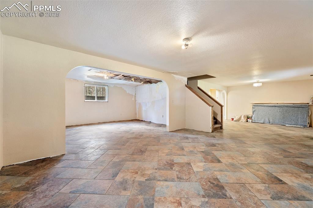 Image 20 of 43: Basement level family room and
recreation space with slate tile
floors