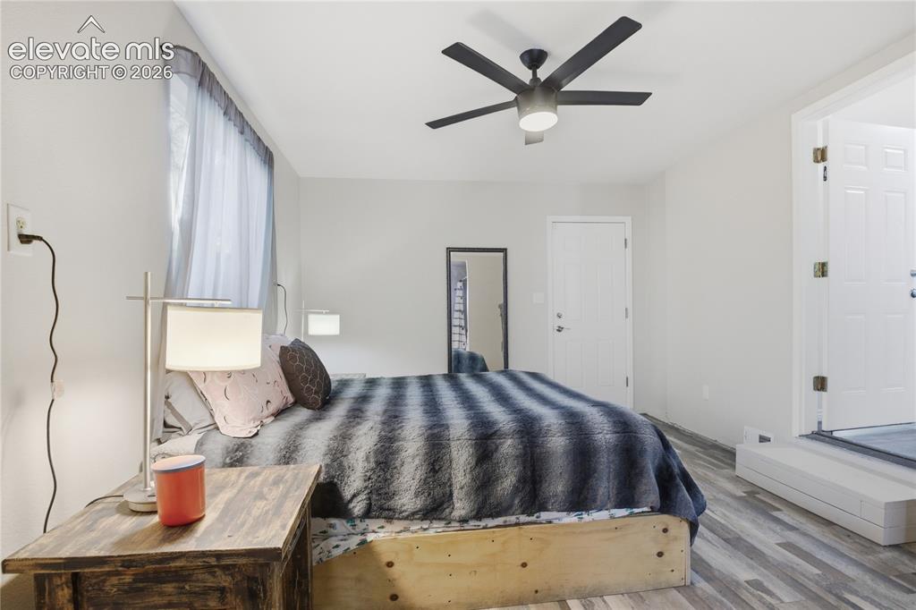 Image 19 of 30: PRIMARY BEDROOM ALSO WALKS OUT TO THE BACKYARD