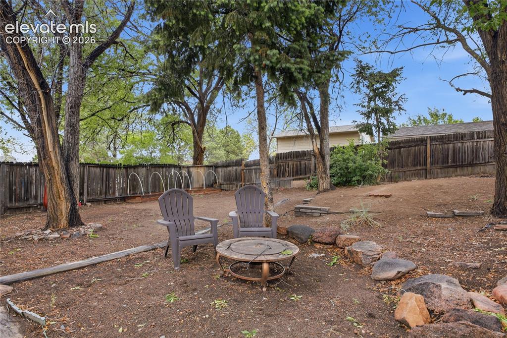 Image 22 of 30: MATURE TREES, COVERED AREAS, AND A SITTING SPACE