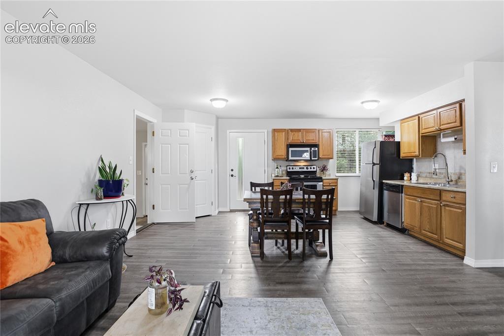 Image 3 of 30: OPEN FLOOR PLAN FILLED WITH NATURAL LIGHT FROM THE LARGE FRONT WINDOWS AND