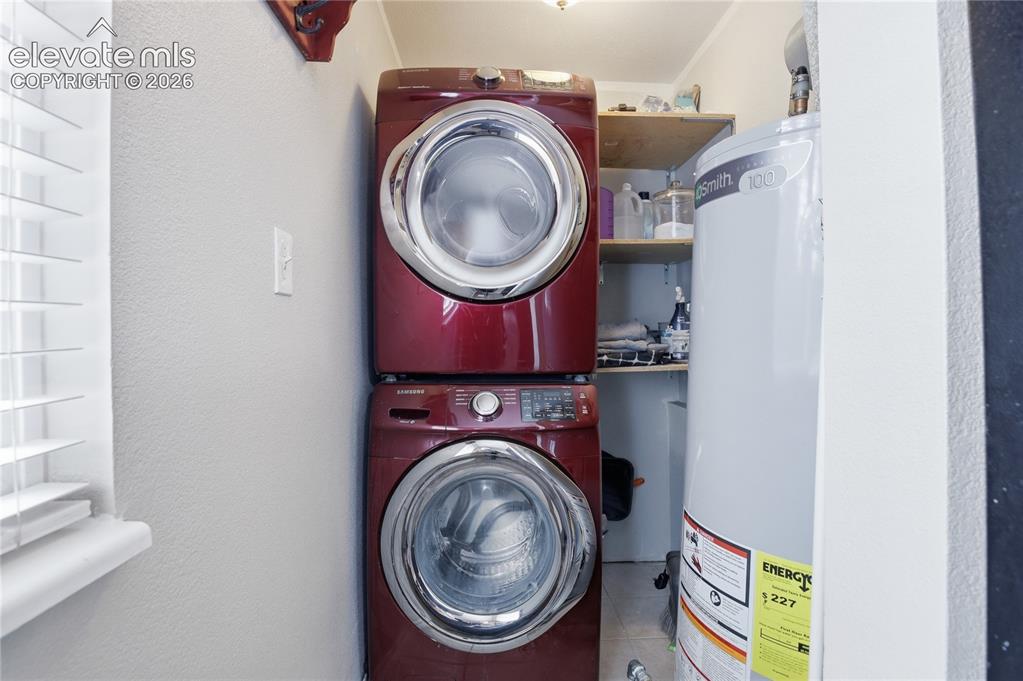 Image 8 of 30: THE MAIN LEVEL INCLUDES CONVENIENT LAUNDRY WITH BUILT-IN SHELVING