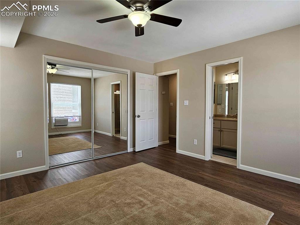 Image 20 of 48: Primary Bedroom with door to upper level bath.