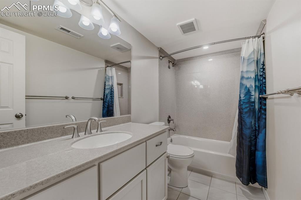 Image 31 of 48: Lower level full bath.