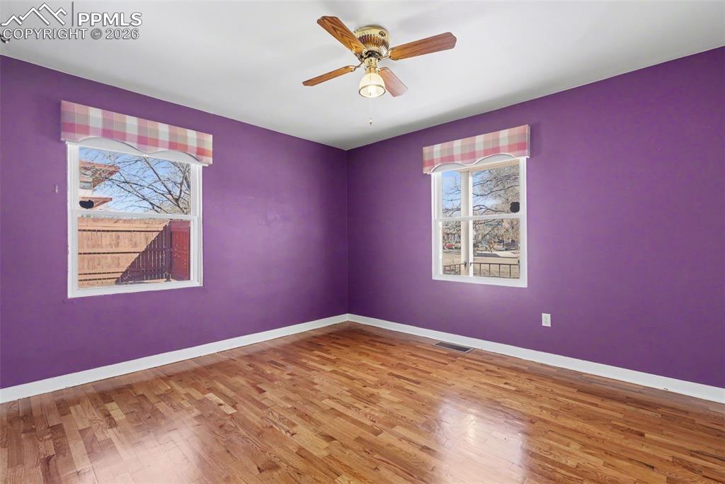 Image 10 of 28: Main level bedroom.