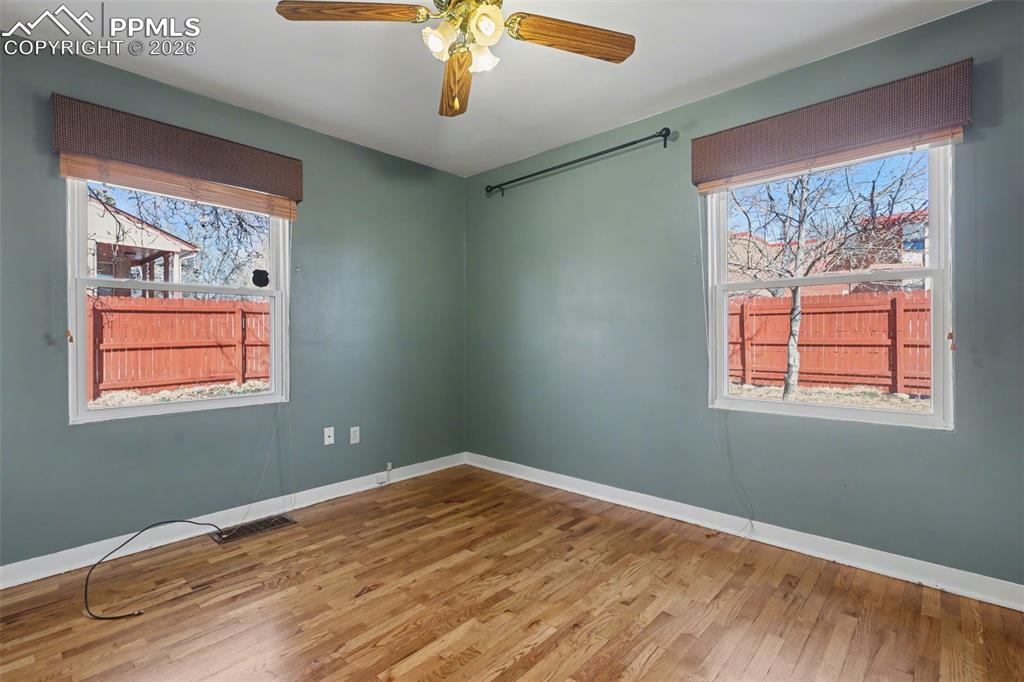 Image 13 of 28: Main level bedroom.
