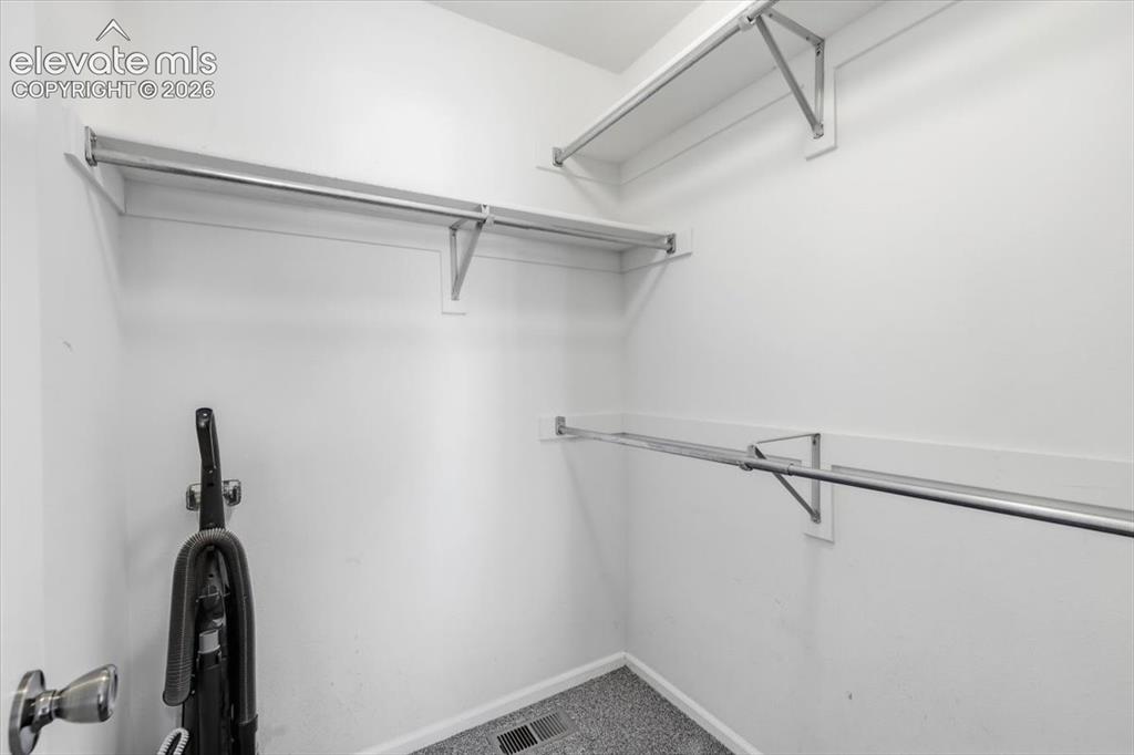 Image 21 of 43: Primary closet.