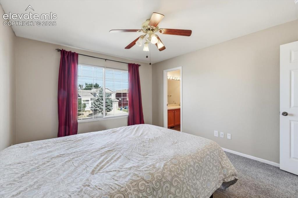 Image 22 of 43: Primary bedroom with attached bathroom.