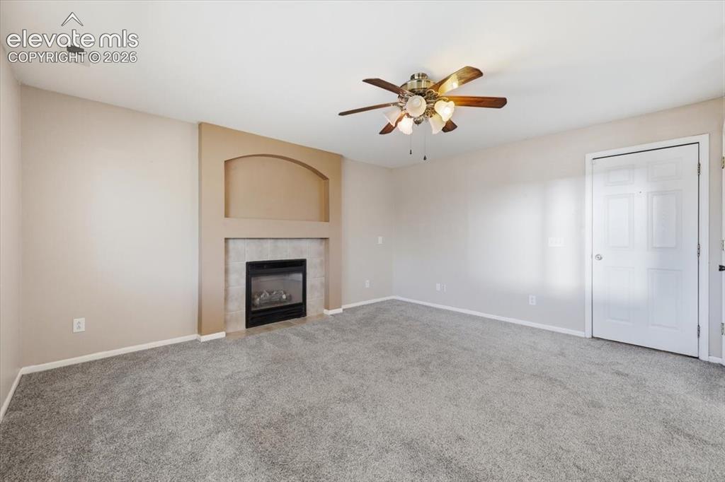 Image 3 of 43: Large family room with gas fireplace.